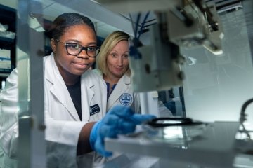 Student and professor in lab