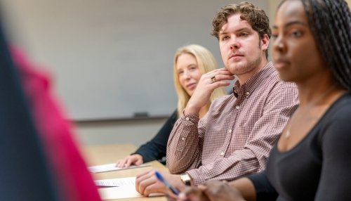 Clinical psychology students participate in a group discussion with faculty.