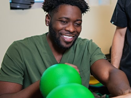 Occupational therapy student works in the clinic.